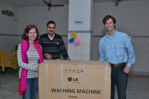 The two of us with the EVAD director and their new washing machine